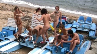 A group of naturists at sea - The natural beauty of the body is one of the goals of naturism and nudism